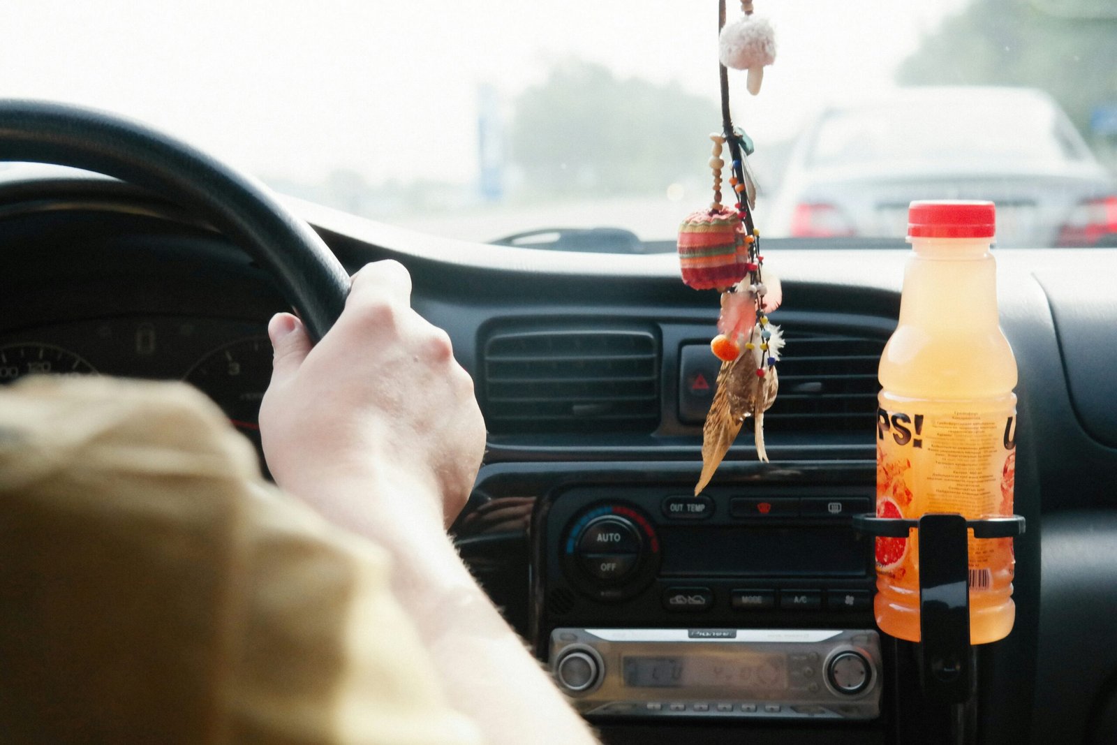 Person driving in summer outfit
